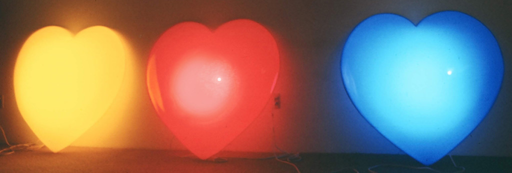 Light Hearts, Marion-Lea JAmieson, 1974; formed sheet acrylic, flourescent fixtures & hardware; each 4' x 4' x 1'.